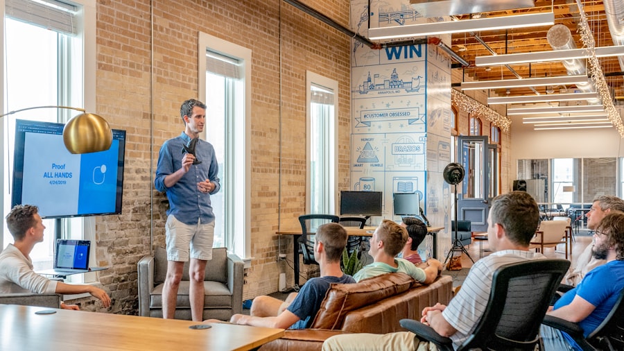 A mentor speaking with a group in a workspace